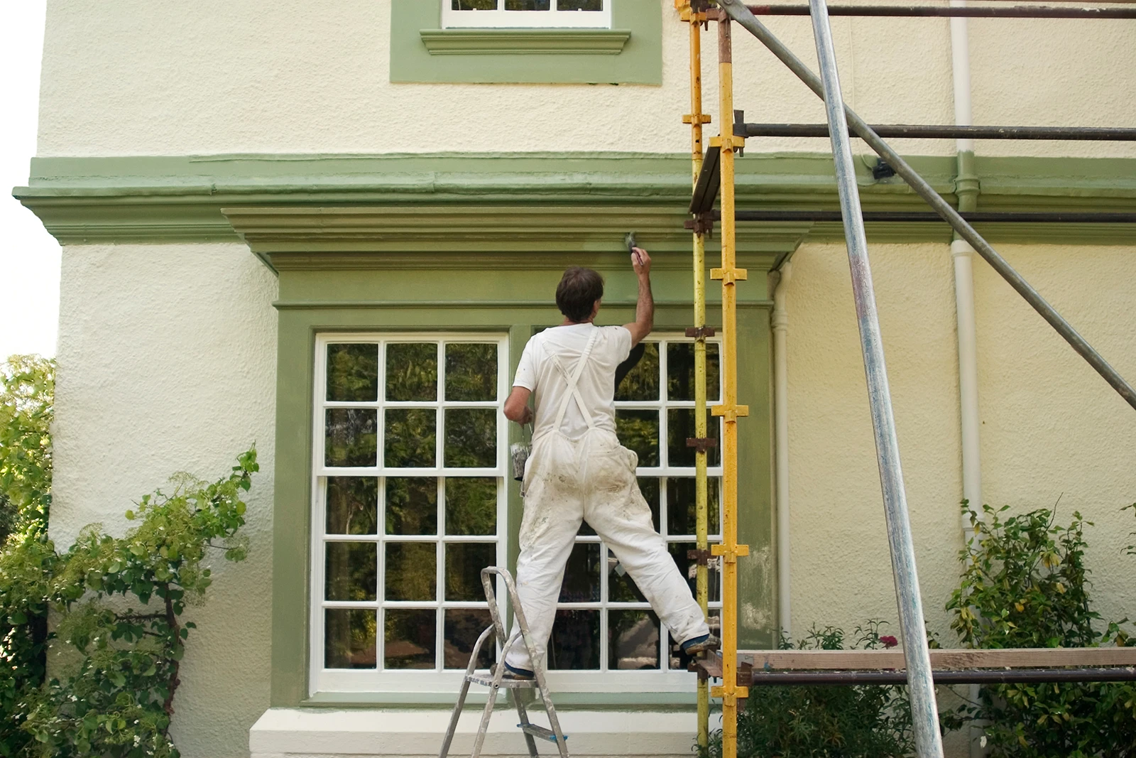 Painting Window Trim Rodgers Painting painter on a ladder painting window trim