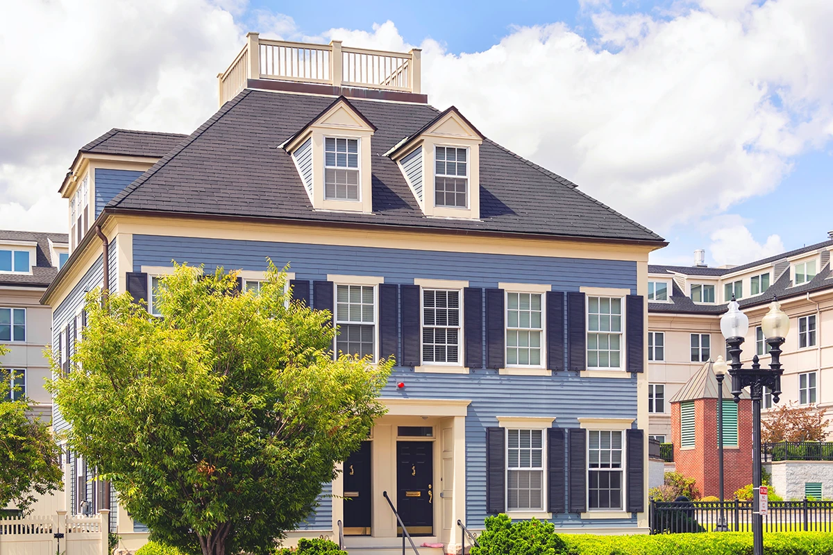 Multi-Family Exterior Blue sided multi family building with dormers