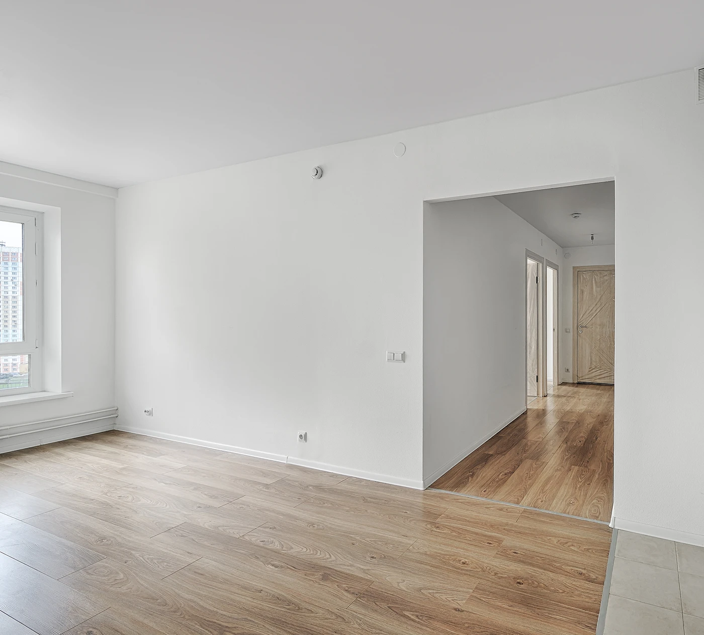Apartment Interior Empty apartment room with fresh white walls and wood floors