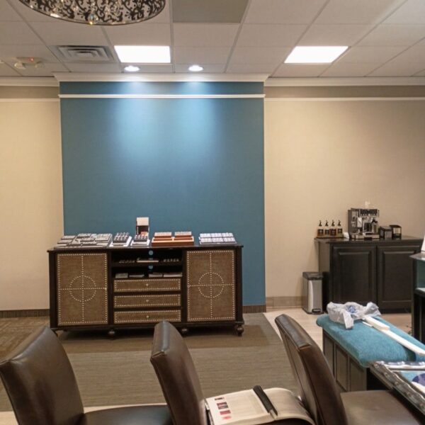 Jewelry store interior with a painted blue accent wall behind display cases
