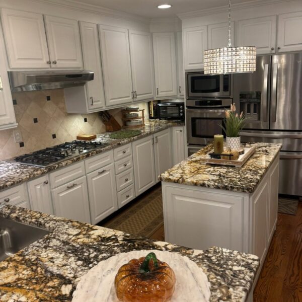 White Kitchen Cabinets Kitchen cabinets painted white around a granite topped island