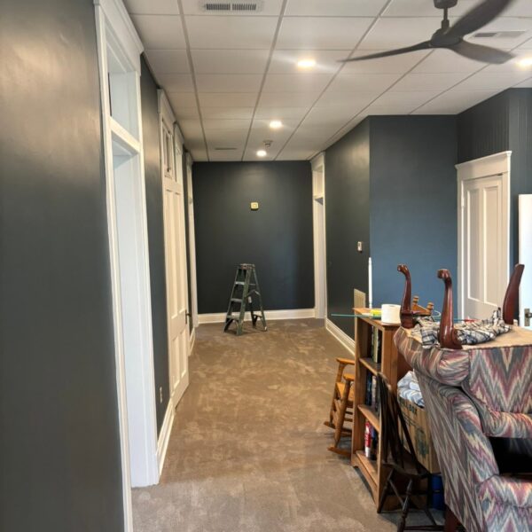Office Hallway Repaint Office hallway painted dark blue gray with white door trim during the job
